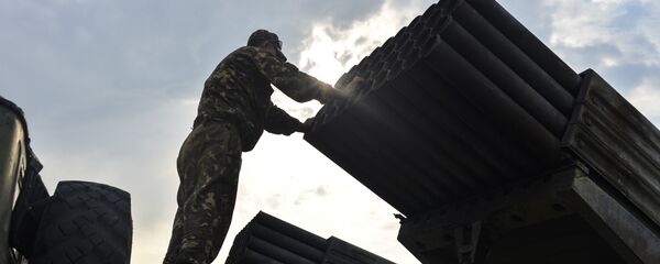 An Ukrainian soldier looks at a Grad multiple rocket launcher system, near the eastern Ukrainian city of Shchastya, Lugansk region, on August 18, 2014 An Ukrainian soldier looks at a Grad multiple rocket launcher system, near the eastern Ukrainian city of Shchastya, Lugansk region, on August 18, 2014 - Sputnik International