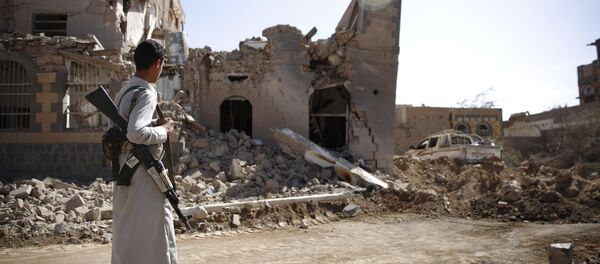 A Shiite fighter, known as a Houthi, look at a house destroyed by Saudi-led airstrikes in Sanaa, Yemen, Wednesday, Oct. 28, 2015 A Shiite fighter, known as a Houthi, look at a house destroyed by Saudi-led airstrikes in Sanaa, Yemen, Wednesday, Oct. 28, 2015 - Sputnik International