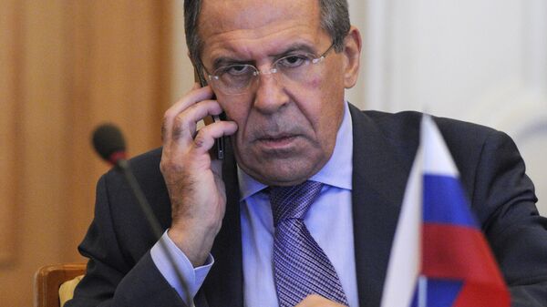 Russian Foreign Minister Sergey Lavrov speaks on the phone during a meeting with the Ukraine's Foreign Minister Kostyantyn Gryshchenko in Kiev, Ukraine, Friday, Oct. 19, 2012 - Sputnik International