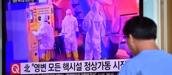 A man watches a news report at a railway station in Seoul on September 15, 2015, on the confirmation from North Korea that the nuclear reactor seen as the country's main source of weapons-grade plutonium had resumed normal operations, raising a further red flag amid growing signs the North may be considering a long-range rocket launch next month in violation of UN resolutions. A man watches a news report at a railway station in Seoul on September 15, 2015, on the confirmation from North Korea that the nuclear reactor seen as the country's main source of weapons-grade plutonium had resumed normal operations, raising a further red flag amid growing signs the North may be considering a long-range rocket launch next month in violation of UN resolutions. - Sputnik International