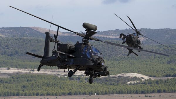 NATO forces in AH-64 Apache helicopters take part in Exercise Trident Juncture 2015, NATO's largest joint and combined military exercise in more than a decade, at the San Gregorio training grounds outside Zaragoza, Spain, November 4, 2015 - Sputnik International