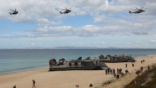 FILE - In this Oct. 20, 2015 file photo, U.S. navy helicopters fly over U.S. Navy hovercraft during the NATO Trident Juncture exercise 2015 at Raposa Media beach in Pinheiro da Cruz, south of Lisbon - Sputnik International
