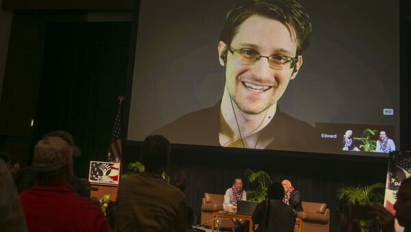 National Security Agency leaker Edward Snowden appears on a live video feed broadcast from Moscow at an event sponsored by the ACLU Hawaii in Honolulu on Saturday, Feb. 14, 2015 - Sputnik International