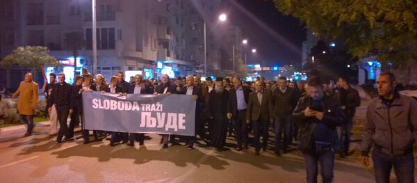 Opposition leaders walked in the front with a banner reading “Freedom Calling Me” in Montenegro Opposition leaders walked in the front with a banner reading “Freedom Calling Me” in Montenegro - Sputnik International