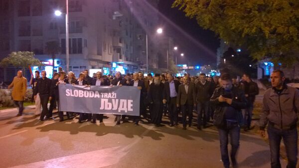 Opposition leaders walked in the front with a banner reading “Freedom Calling Me” in Montenegro - Sputnik International