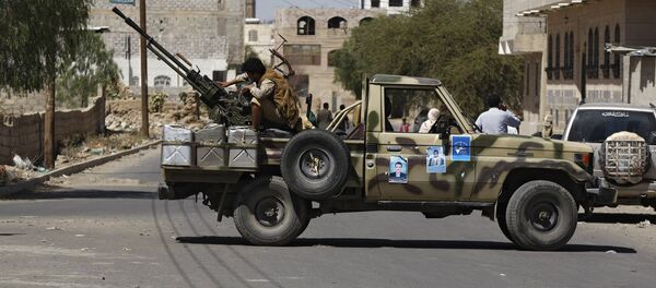 Houthi Shiite rebel mans a machine gun mounted on a military truck in Sanaa, Yemen, Monday, Oct. 20, 2014 Houthi Shiite rebel mans a machine gun mounted on a military truck in Sanaa, Yemen, Monday, Oct. 20, 2014 - Sputnik International
