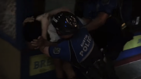 Screenshot of video capturing Austin police officers detaining a man for jaywalking - Sputnik International
