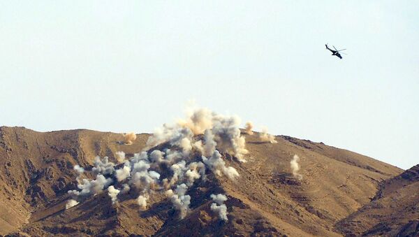 A file photo showing Russian Mi-24P attack helicopters conducting an air strike on terrorist's positions near the city of Palmyra - Sputnik International