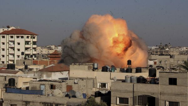 File photo of a ball of fire rises from an explosion following an Israeli air strike on the house in the southern Gaza Strip, Tuesday, Aug. 26, 2014 - Sputnik International