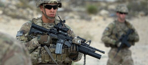 In this photograph taken on August 30, 2015, US soldiers part of NATO patrol during the final day of a month long anti-Taliban operation by the Afghan National Army (ANA) in various parts of eastern Nangarhar province, at an Afghan National Army base in Khogyani district In this photograph taken on August 30, 2015, US soldiers part of NATO patrol during the final day of a month long anti-Taliban operation by the Afghan National Army (ANA) in various parts of eastern Nangarhar province, at an Afghan National Army base in Khogyani district - Sputnik International
