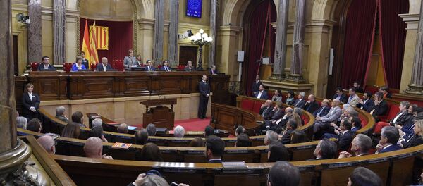 Carme Forcadell (C) delivers her first speech as Parliament's new president during the Catalan regional Parliament's constitutive session on October 26, 2015 in Barcelona Carme Forcadell (C) delivers her first speech as Parliament's new president during the Catalan regional Parliament's constitutive session on October 26, 2015 in Barcelona - Sputnik International