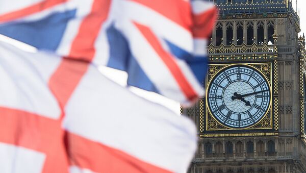 A British Union Jack flag and a flag of England fly in front of Big Ben in the Houses of Parliament in London, Britain, 02 April 2015 - Sputnik International