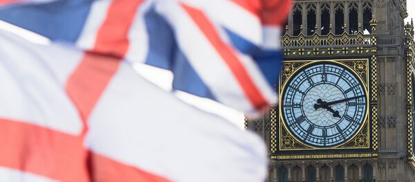A British Union Jack flag and a flag of England fly in front of Big Ben in the Houses of Parliament in London, Britain, 02 April 2015 - Sputnik International