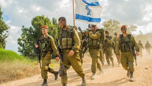 Soldiers from the IDF Home Front Command’s Search and Rescue Brigade complete their beret march in southern Israel after finishing eight months of training - Sputnik International