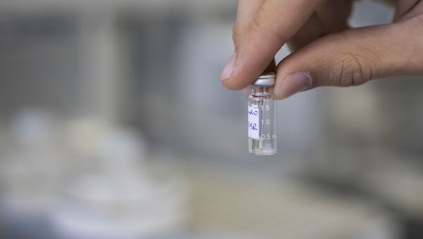 A lab technician shows a sample to be tested for doping  - Sputnik International