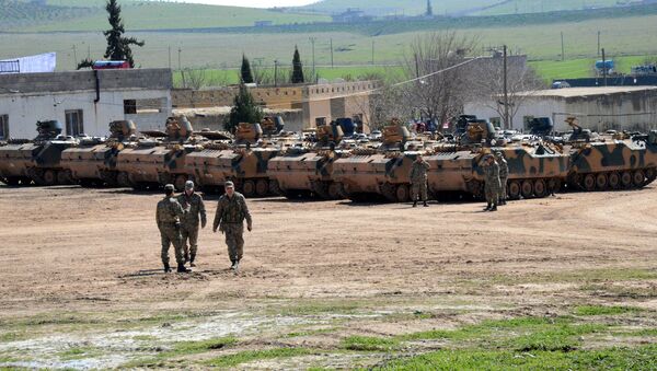 Turkish Army vehicles and tanks wait near the Syrian border in Suruc - Sputnik International