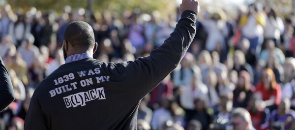A member of the black student protest group Concerned Student 1950 gestures while addressing a crowd following the announcement that University of Missouri System President Tim Wolfe would resign Monday, Nov. 9, 2015, at the university in Columbia, Mo. Wolfe resigned Monday with the football team and others on campus in open revolt over his handling of racial tensions at the school. A member of the black student protest group Concerned Student 1950 gestures while addressing a crowd following the announcement that University of Missouri System President Tim Wolfe would resign Monday, Nov. 9, 2015, at the university in Columbia, Mo. Wolfe resigned Monday with the football team and others on campus in open revolt over his handling of racial tensions at the school. - Sputnik International