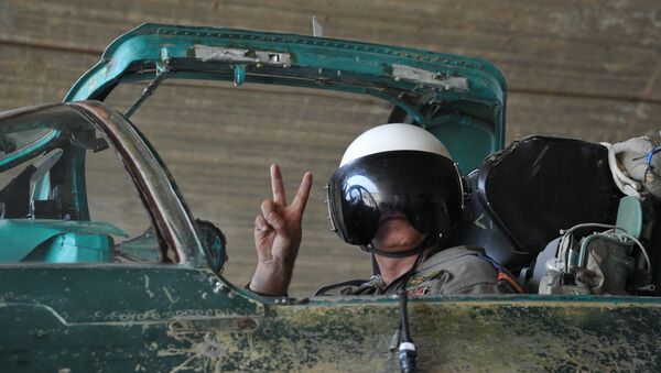 A Syrian pilot before a mission at the Hama airbase near the city of Hama, Syria's Hama Province. - Sputnik International