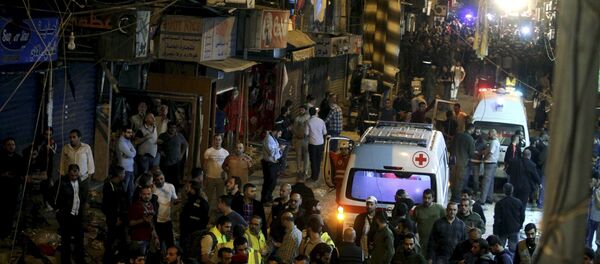 Red Cross vehicles drive by as residents and Lebanese army members inspect a damaged area caused by two explosions in Beirut's southern suburbs, Lebanon November 12, 2015 Red Cross vehicles drive by as residents and Lebanese army members inspect a damaged area caused by two explosions in Beirut's southern suburbs, Lebanon November 12, 2015 - Sputnik International