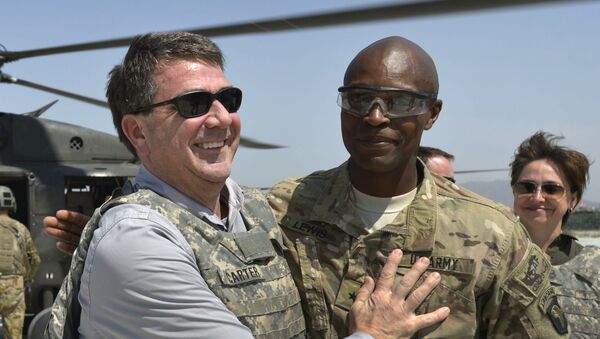 In this photo provided by the Department of Defense, then-U.S. Army Brig. Gen. Ron Lewis, right, greets then-Deputy Secretary of Defense Ash Carter, left, in Jalalabad, Afghanistan, May 13, 2013 - Sputnik International
