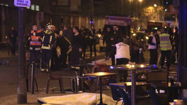 Rescue workers and medics work by victims in a Paris restaurant, Friday, Nov. 13, 2015. Police officials in France on Friday reported a shootout in a Paris restaurant and an explosion in a bar near a Paris stadium. - Sputnik International