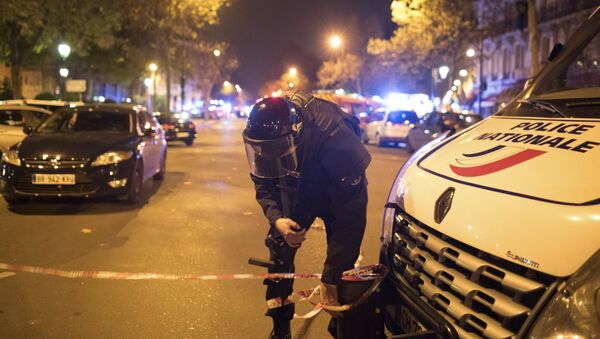 A police officer secures the area outside the Bataclan theater in Paris, France, Wednesday, Nov. 13, 2015.  - Sputnik International