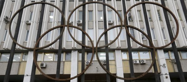 A woman walks out of the Russian Olympic Committee headquarters building, which also houses the management of Russian Athletics Federation in Moscow, Russia, November 13, 2015 A woman walks out of the Russian Olympic Committee headquarters building, which also houses the management of Russian Athletics Federation in Moscow, Russia, November 13, 2015 - Sputnik International