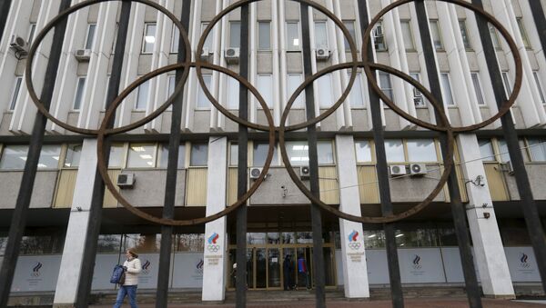 A woman walks out of the Russian Olympic Committee headquarters building, which also houses the management of Russian Athletics Federation in Moscow, Russia, November 13, 2015 - Sputnik International