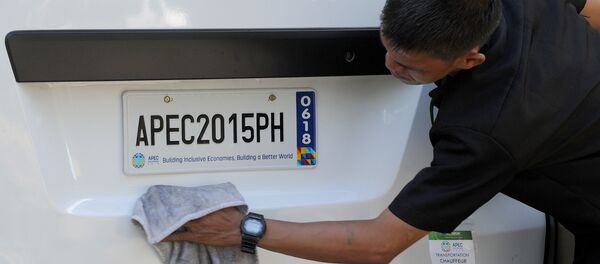 A man polishes a car, one of the hundred of new cars that will be used during the Asia Pacific Economic Cooperation (APEC) summit to be held in the Philippines later this month, in Manila on November 8, 2015 A man polishes a car, one of the hundred of new cars that will be used during the Asia Pacific Economic Cooperation (APEC) summit to be held in the Philippines later this month, in Manila on November 8, 2015 - Sputnik International
