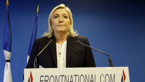 Leader of the French Far-right party the Front National (FN) Marine Le Pen delivers an address in Nanterre, suburban Paris on November 14, 2015, in response to the attacks in which at least 128 people were killed - Sputnik International