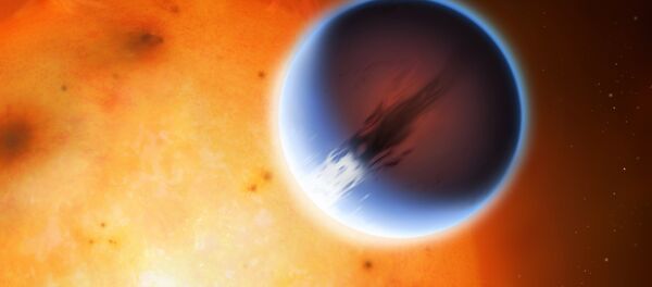 The planet HD 189733b is shown here in front of its parent star The planet HD 189733b is shown here in front of its parent star - Sputnik International