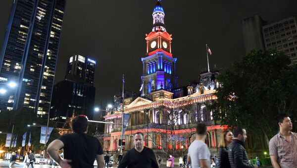 The Town Hall of Sydney, Australia, lit up in French national colors in remembrance of the victims of the November 13th Paris terror attacks. The famous Sydney Opera House was bathed in the French colors, as well. - Sputnik International