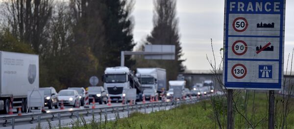 A view shows vehicles queueing in the highway from Paris to Brussels as Belgian and French police officers control the crossing of vehicles on the border between the two countries, following the deadly Paris attacks, in Crespin, France, November 14, 2015 - Sputnik International