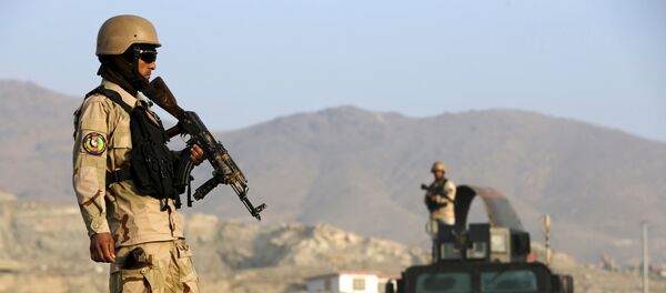 File photo of an Afghan policemen stand guard at a checkpoint in the Deh Sabz district of Kabul, Afghanistan October 14, 2015 - Sputnik International