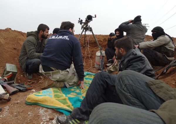 Opposition fighters from the Ahrar Al-Sham brigade, part of the Islamic front coalition, hold a position in the Sheikh Lutfi neighbourhood of the northern Syrian city of Aleppo during ongoing clashes with government forces on January 27, 2014 Opposition fighters from the Ahrar Al-Sham brigade, part of the Islamic front coalition, hold a position in the Sheikh Lutfi neighbourhood of the northern Syrian city of Aleppo during ongoing clashes with government forces on January 27, 2014 - Sputnik International