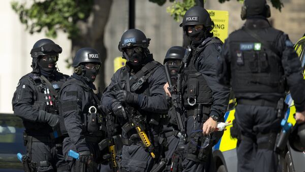 Near the start of a training exercise for London's emergency services, armed police officers stand near the disused Aldwych underground train station in London, Tuesday, June 30, 2015 - Sputnik International