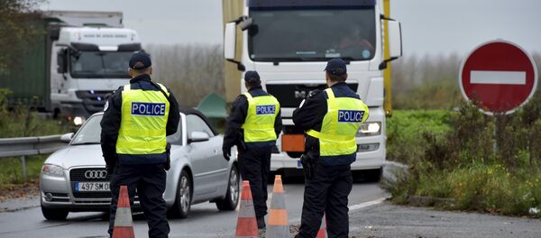 French police officers provide security as they control the crossing of vehicles on the border between the two countries, following the deadly Paris attacks, in Crespin, France, November 14, 2015 French police officers provide security as they control the crossing of vehicles on the border between the two countries, following the deadly Paris attacks, in Crespin, France, November 14, 2015 - Sputnik International
