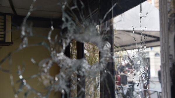 Bullet holes are seen in the window of a Japanese restaurant next to the cafe 'La Belle Equipe' at the Rue de Charonne in Paris on November 14, 2015, following a series of coordinated attacks in and around Paris late Friday - Sputnik International