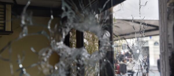 Bullet holes are seen in the window of a Japanese restaurant next to the cafe 'La Belle Equipe' at the Rue de Charonne in Paris on November 14, 2015, following a series of coordinated attacks in and around Paris late Friday Bullet holes are seen in the window of a Japanese restaurant next to the cafe 'La Belle Equipe' at the Rue de Charonne in Paris on November 14, 2015, following a series of coordinated attacks in and around Paris late Friday - Sputnik International