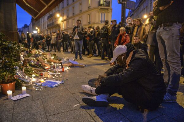 Parisians by the Le Carillon restaurant in Paris where a terrorist attack took place in 2015 Parisians by the Le Carillon restaurant in Paris where a terrorist attack took place in 2015 - Sputnik International