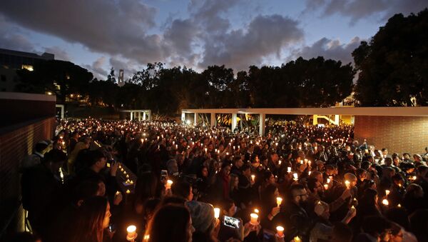 Well-wishers hold up candles during a memorial service for California State Long Beach student Nohemi Gonzalez on Sunday, Nov. 15, 2015 in Long Beach, Calif., who was killed at restaurant in Paris on Friday night during the terrorist attacks - Sputnik International