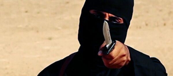 This image made from militant video, which has been verified by SITE Intel Group and is consistent with other AP reporting, shows Mohammed Emwazi , known as Jihadi John, holding a knife This image made from militant video, which has been verified by SITE Intel Group and is consistent with other AP reporting, shows Mohammed Emwazi , known as Jihadi John, holding a knife - Sputnik International