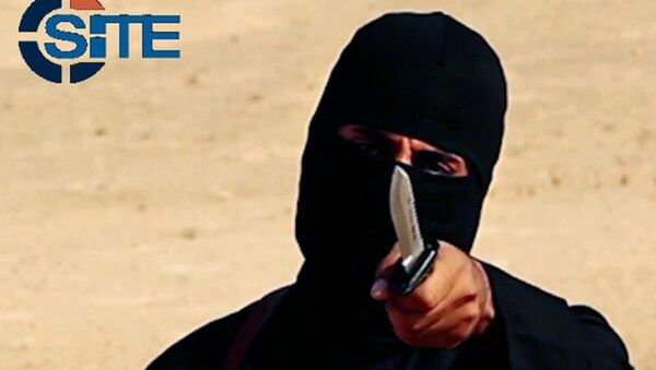 This image made from militant video, which has been verified by SITE Intel Group and is consistent with other AP reporting, shows Mohammed Emwazi , known as Jihadi John, holding a knife - Sputnik International