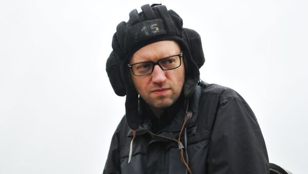 File Photo: Ukrainian Prime Minister Arseniy Yatsenyuk during a visit to the International Center for Peacemaking and Security of the Academy of Land Forces at the Yavoriv Training Ground in the Lviv region. - Sputnik International