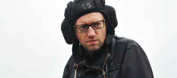 File Photo: Ukrainian Prime Minister Arseniy Yatsenyuk during a visit to the International Center for Peacemaking and Security of the Academy of Land Forces at the Yavoriv Training Ground in the Lviv region. - Sputnik International