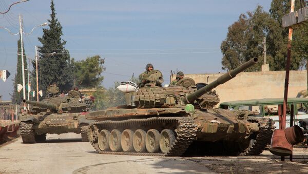Syrian Army tanks enter a village near the Kweyris military air base, in the east of the northern Syrian province of Aleppo, after they took control of the surrounding villages from Daesh. file photo - Sputnik International