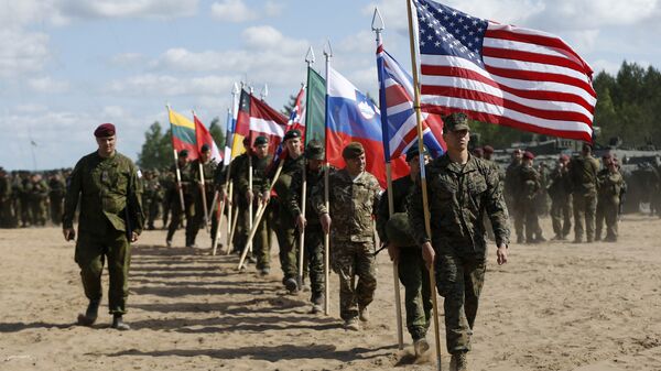 Soldiers from NATO countries attend an opening ceremony of military exercise 'Saber Strike 2015', at the Gaiziunu Training Range in Pabrade some 60km.(38 miles) north of the capital Vilnius, Lithuania, Monday, June 8, 2015 - Sputnik International
