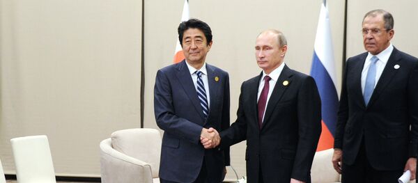 Japanese Prime Minister Shinzo Abe, left, shakes hands with Russian President Vladimir Putin prior their talks during the G-20 Summit in Antalya, Turkey, Monday, Nov. 16, 2015 Japanese Prime Minister Shinzo Abe, left, shakes hands with Russian President Vladimir Putin prior their talks during the G-20 Summit in Antalya, Turkey, Monday, Nov. 16, 2015 - Sputnik International
