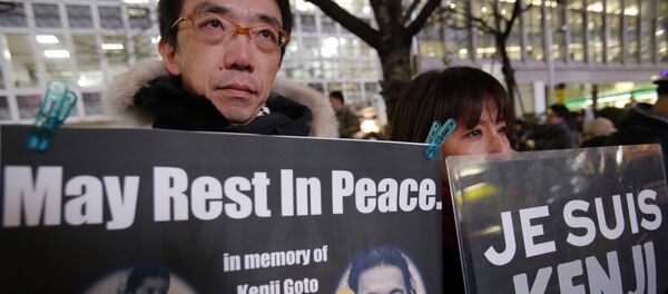 People gather to mourn two Japanese hostages, Kenji Goto and Haruna Yukawa, who were killed by the Islamic State group, in Tokyo, Sunday, Feb. 8, 2015 People gather to mourn two Japanese hostages, Kenji Goto and Haruna Yukawa, who were killed by the Islamic State group, in Tokyo, Sunday, Feb. 8, 2015 - Sputnik International