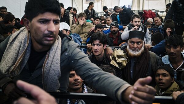 A man argues as he waits along with other migrants and refugees, at a registration camp after crossing the Greek-Macedonian border near Gevgelija on November 14, 2015 - Sputnik International